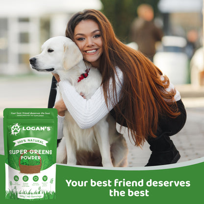 Smiling woman hugging her dog next to Logan's Super Greens Powder packaging, showing a happy and healthy pet lifestyle.